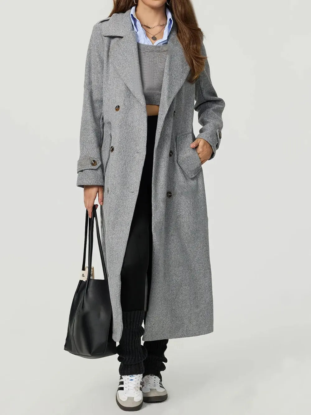 Model wearing the grey Dina Collared Longline Coat from Euriella.